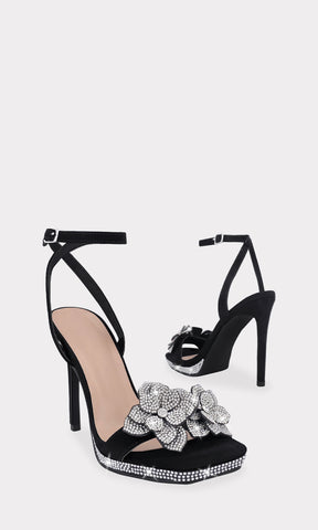 IVETH ZAPATILLAS NEGRAS CON DETALLE DE FLORES 3D AL FRENTE DE PUNTA SEMI CUADRADA HECHAS EN NUBOCK CON BRILLOS EN PLATAFORMA DE 1.5 CM PARA MUJER 