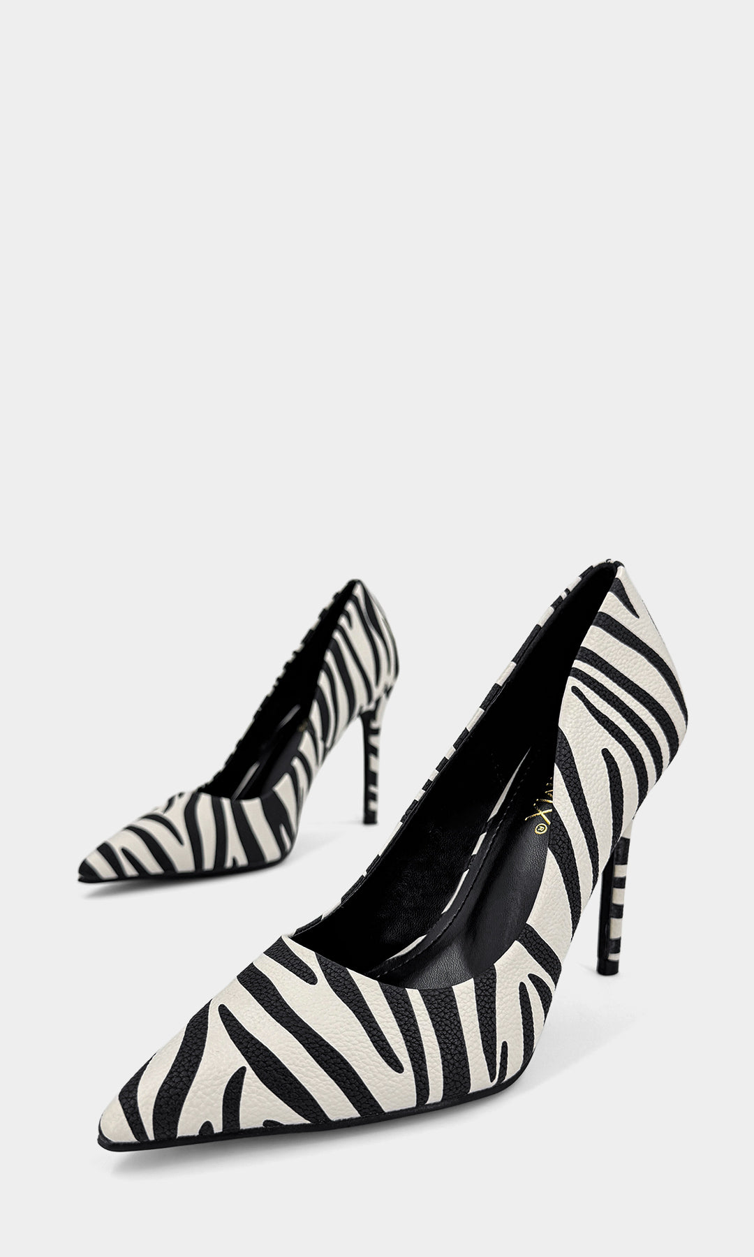 KENYA STILETTOS ANIMAL PRINT DE TACON ALTO 10.5 CM CONFECCIONADOS EN CUERO SINTETICO ESTAMPADO DE CEBRA Y PUNTA CERRADA PUNTIAGUDA PARA MUJER