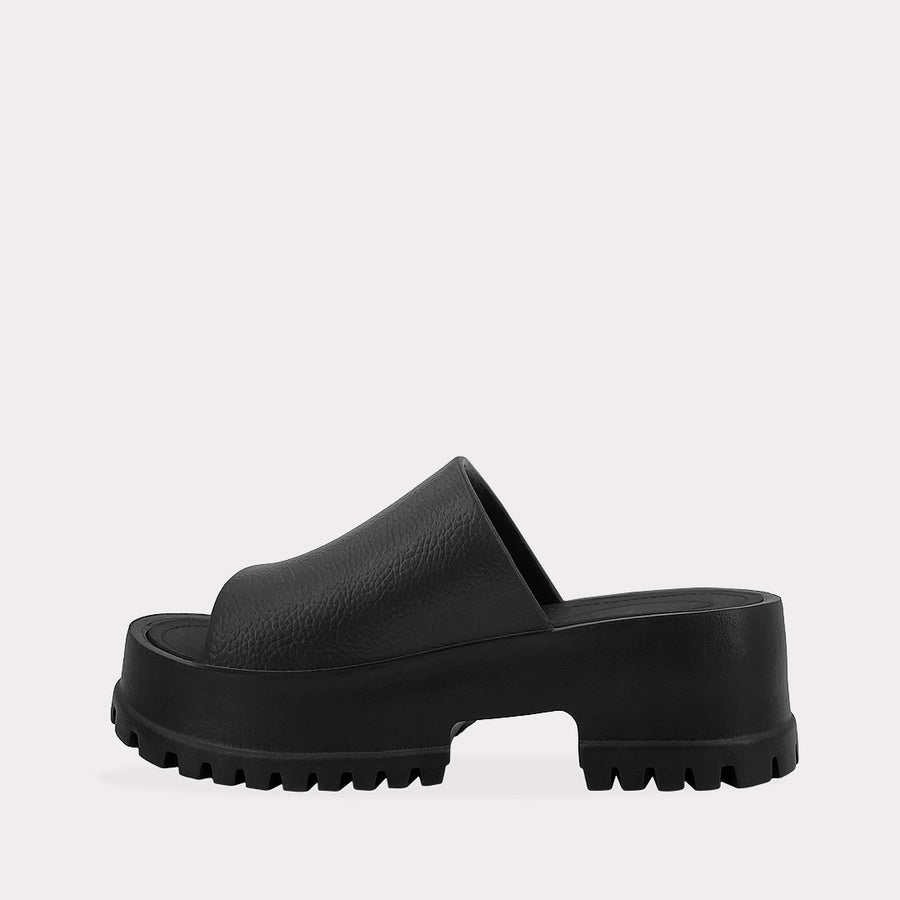 LIMA COMO COMBINAR CHANCLAS NEGRAS DE PLATAFORMA CON FALDA DE RAYAS Y BLUSA LILA EN UN LOOK DE DIA PARA SALIR DE SHOPPING 