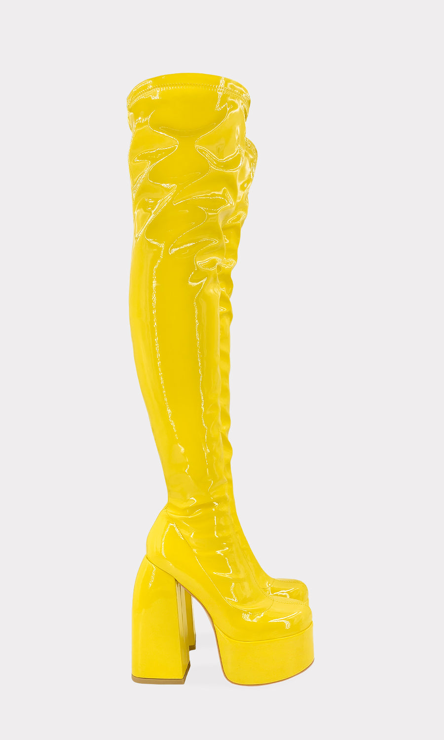 MOTOMAMI BOTAS LARGAS DE CHAROL ELASTICO COLOR AMARILLO CON PLATAFORMA PARA COMBINAR CON MINI FALDAS DE PRINT SNAKE