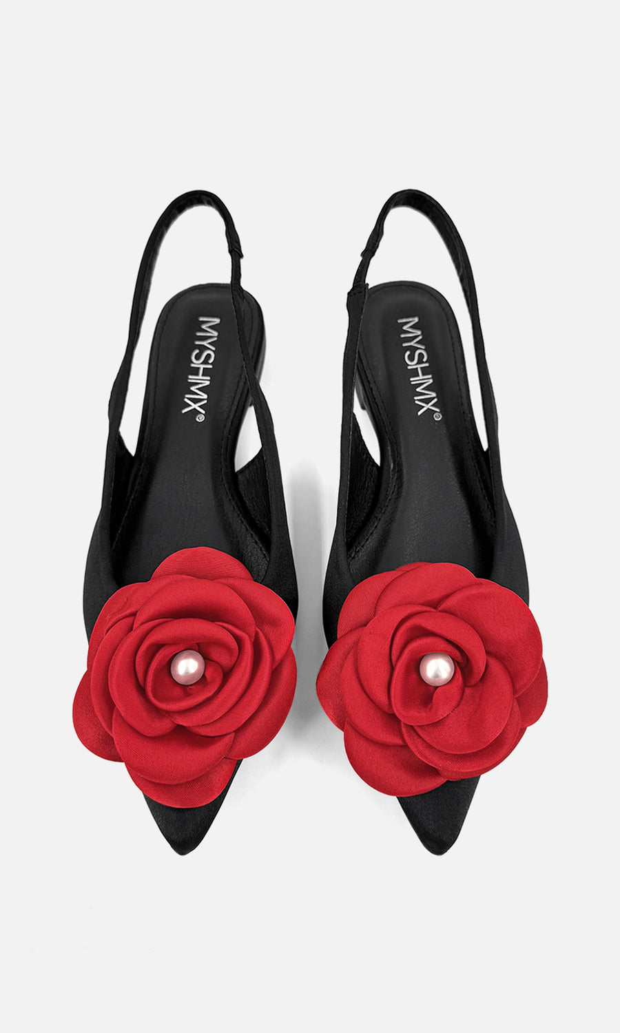 PROMISE FASHION LOOK USANDO FLATS NEGROS CON FLOR ROJA EN PUNTA MIENTRAS MODELO COMBINA FALDA NEGRA Y BLUSA BLANCA CON CORBATA 