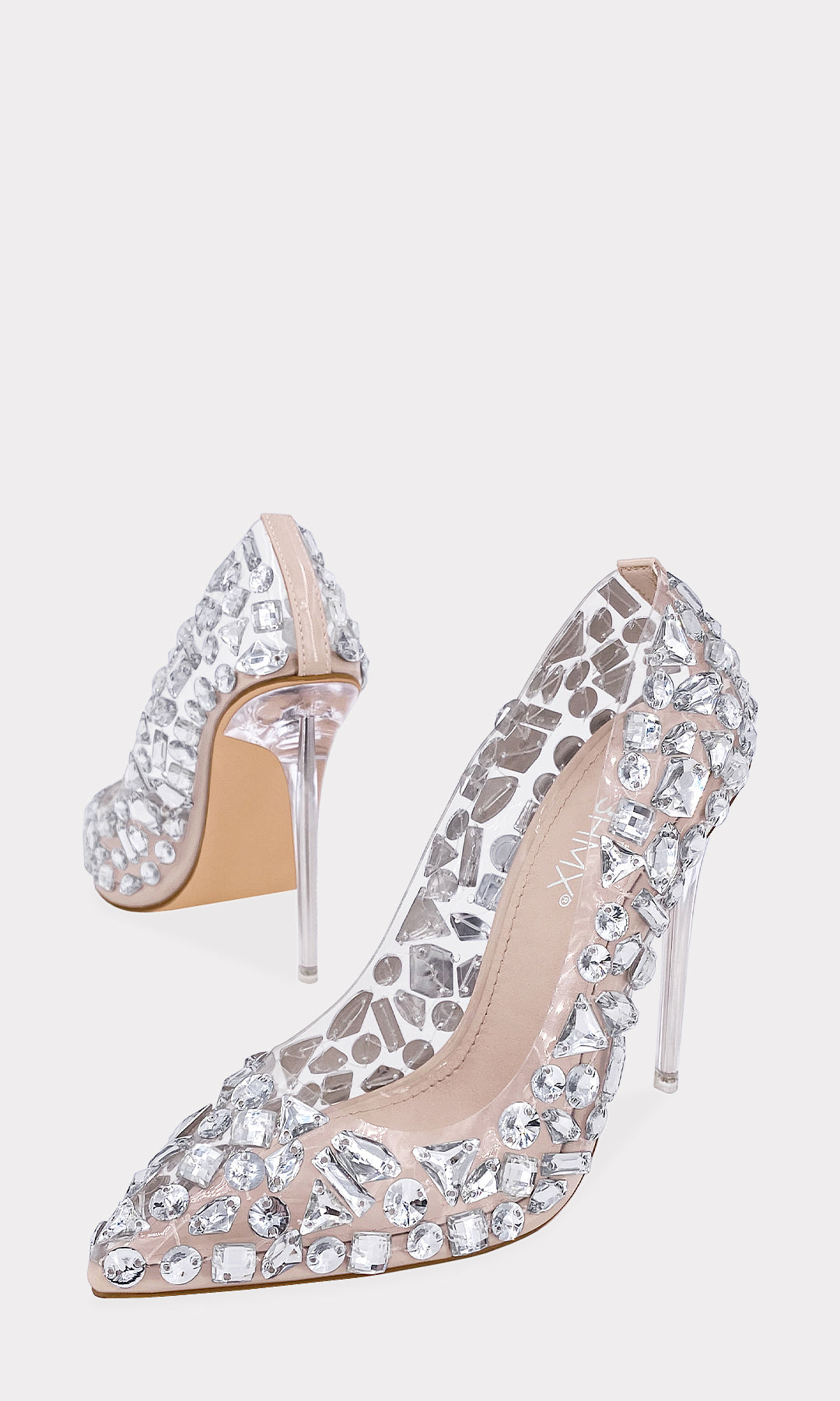 SAPPHIRE STILETTOS NUDE CONFECCIONADOS EN MICA TRASNPARENTE CON PEDRERIA PLATEADA AL FRENTE DE TERMINACION PUNTIAGUDA Y TACON DE 11 CM TRASPARENTE