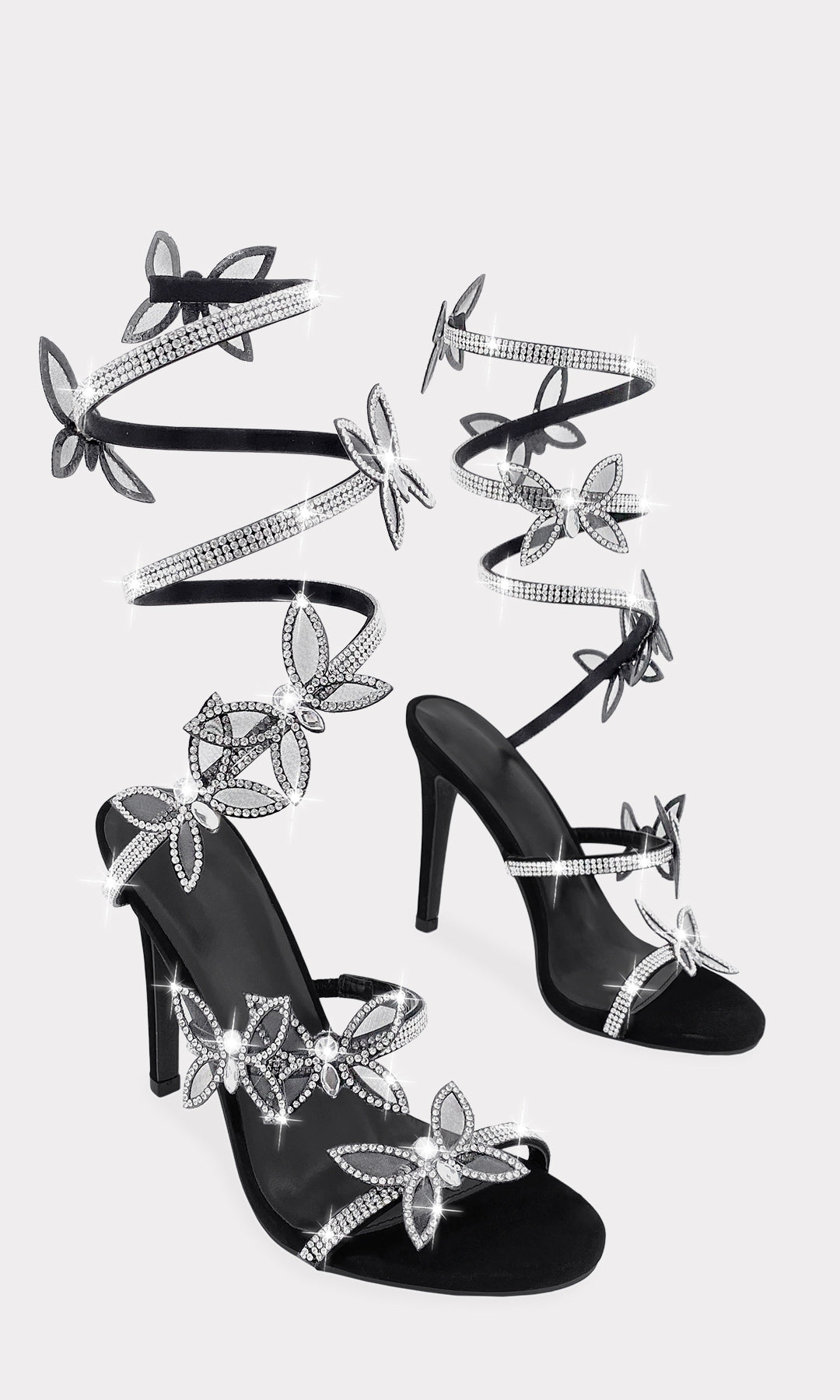 SUGEY ZAPATILLAS NEGRAS DE PUNTA ABIERTA CON BRILLOS Y MARIPOSAS EN ESPIRAL RIGIDO CON TACON DELGADO DE 10.5 CM CONFECCIONADOS EN NUBOCK