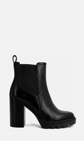 Vista lateral de botín Chelsea negro Oriana con panel elástico, plataforma ligera, tacón grueso de 10 cm y diseño versátil para oficina, salidas, otoño, invierno y outfits de moda para mujer.